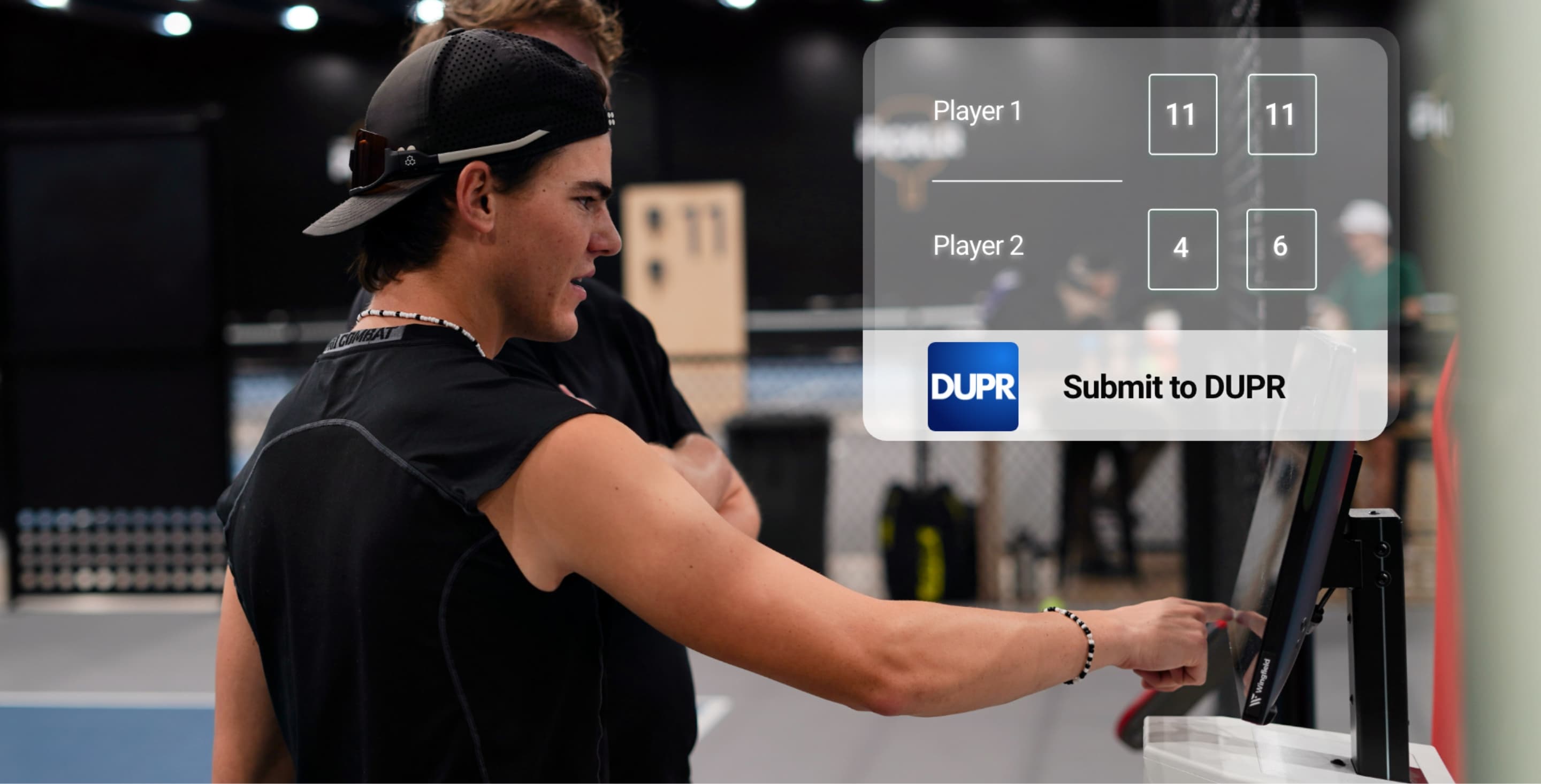 Player enters DUPR match result via touchscreen on the Wingfield system