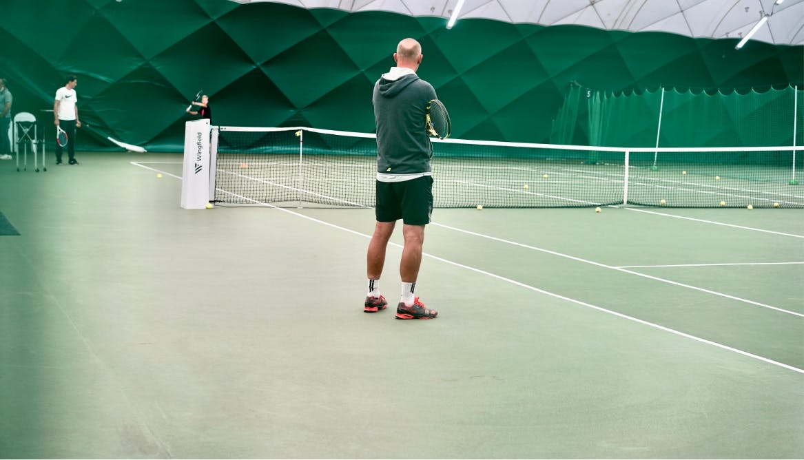 Trainer on the court next to a Wingfield Box.